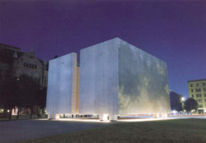 JFK Memorial at nighttime, lit from below. This is where Sarah Cockrell's original St. Nicholas hotel burnt to the ground in the Fire of 1860 although she would quickly rebuild.