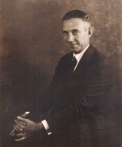 Abraham Lincoln Neiman, co-founder of Neiman-Marcus and husband of Carrie Marcus, is shown in an undated black and white photo, seated and rather smirky.