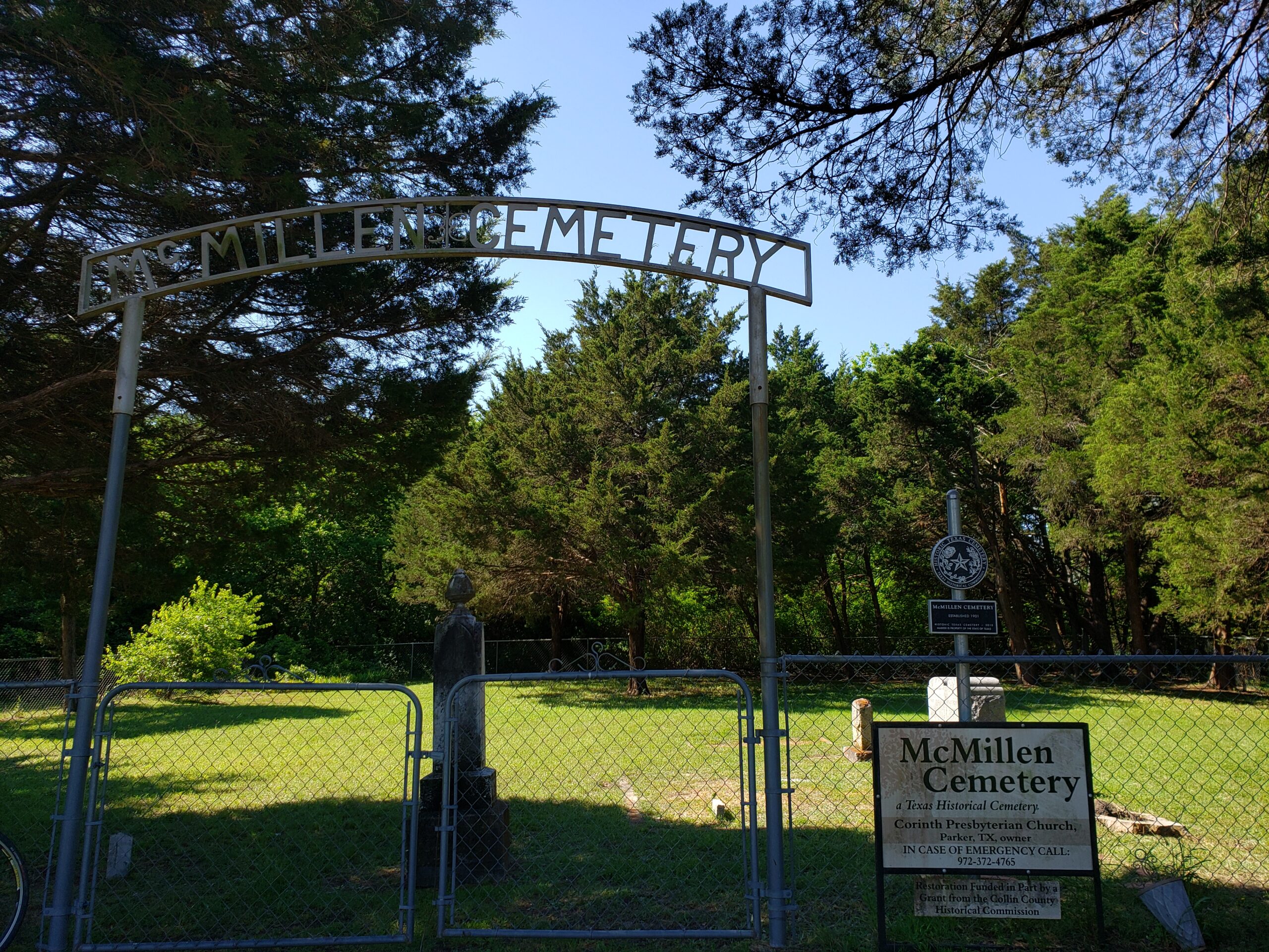 A general view of the steel arched entrance to the McMillen Cemetery.