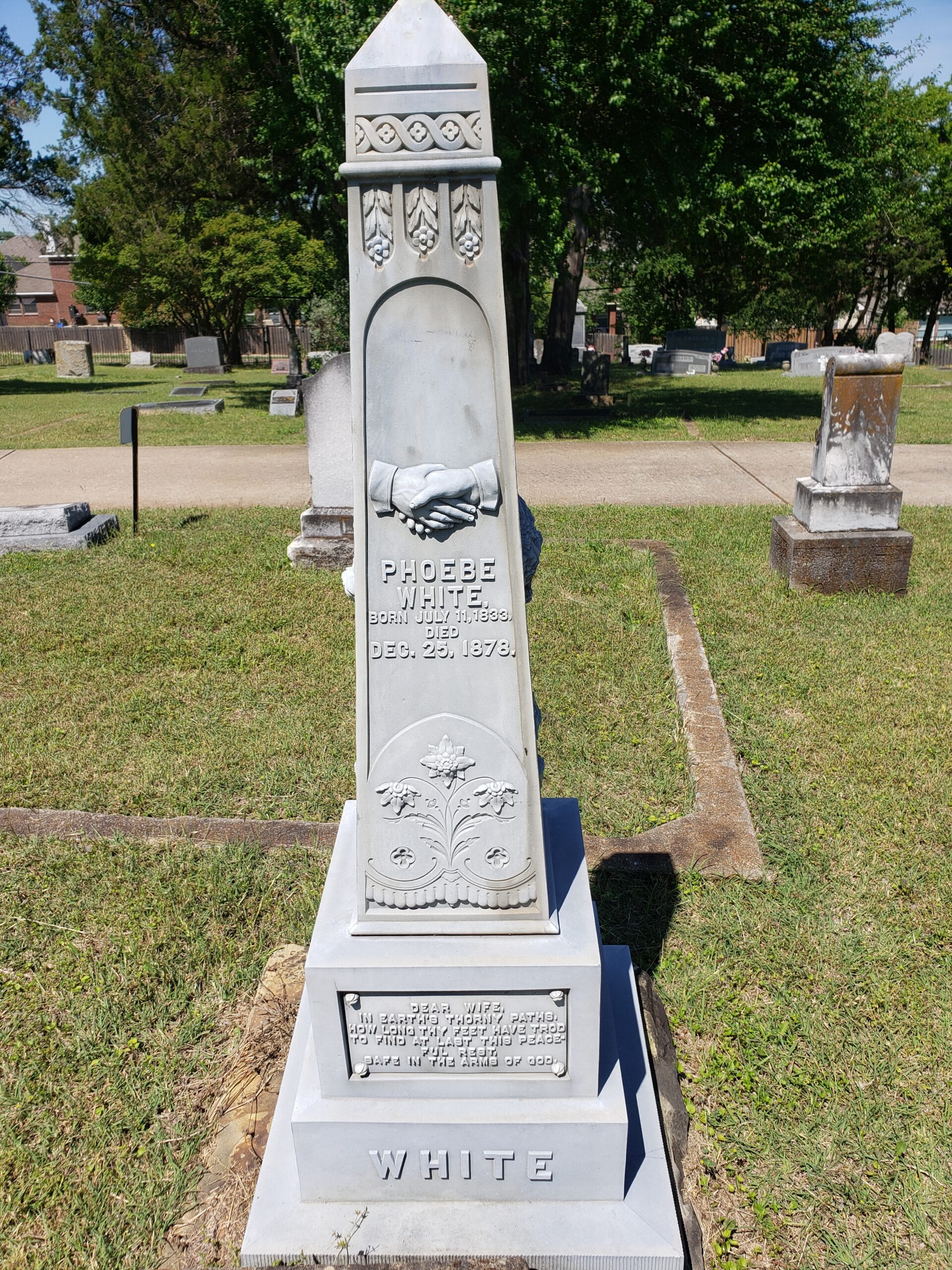 Phoebe White, zinc headstone from Pleasant ridge cemetery - this side has two hands shaking and delicate flowers